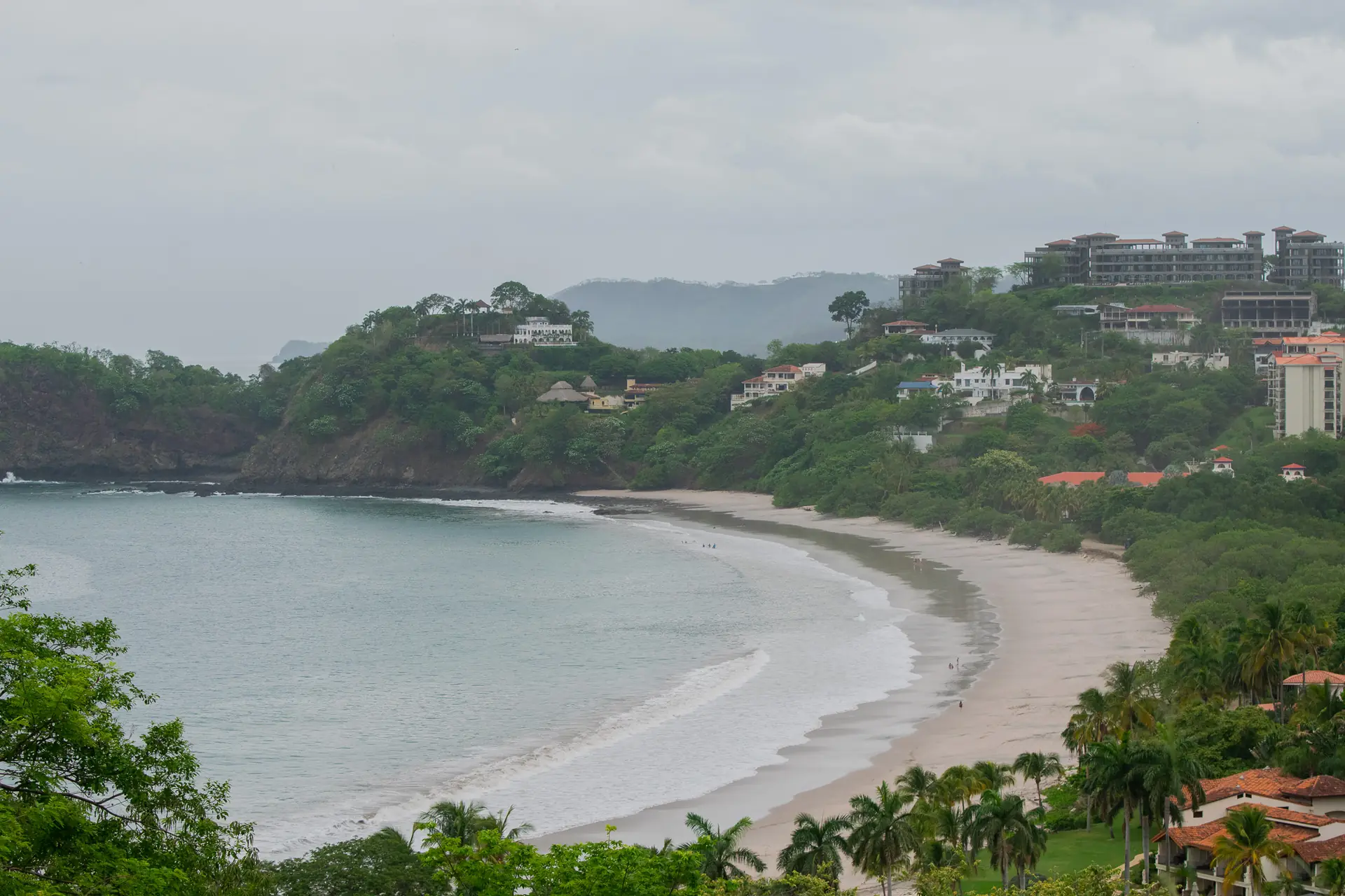 Curved bay with a small beach town in Guanacaste